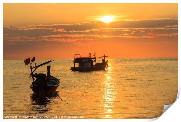 Silhouettes of boats on Bang Tao Beach Print by Kevin Hellon