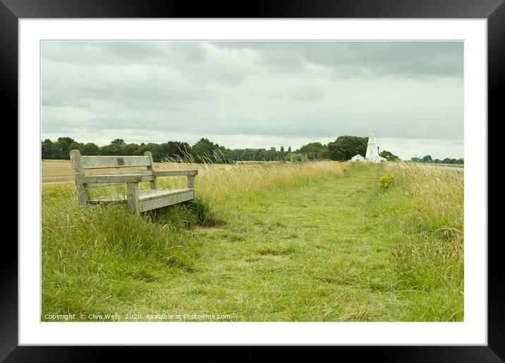 Have a seat and rest by the Lighthouse at Sutton B Framed Mounted Print by Clive Wells