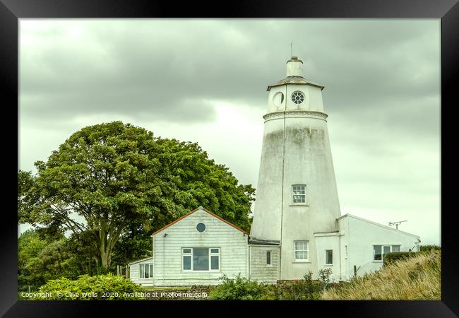 A dirty Sir Peter Scott Lighthouse still stands pr Framed Print by Clive Wells