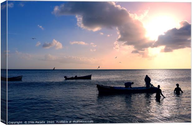 Caribbean fishermen at sunset Canvas Print by Ines Porada
