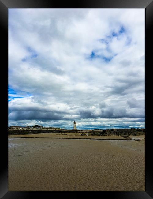 The lighthouse in the distance  Framed Print by Paddy 