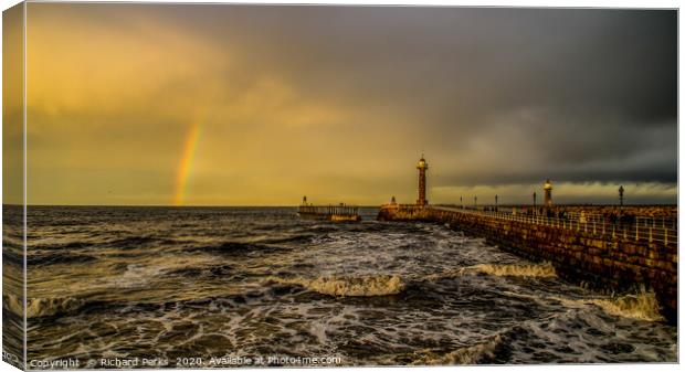 Rainbow`s end at Whitby Pier Canvas Print by Richard Perks
