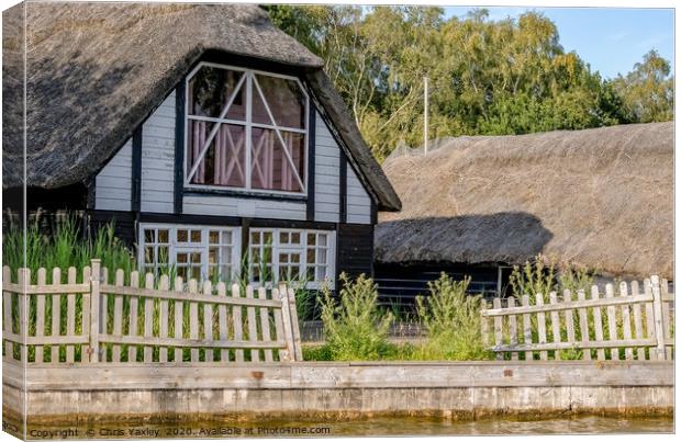 Traditional riverside cottage with thatched roof Canvas Print by Chris Yaxley