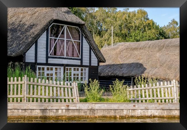 Traditional riverside cottage with thatched roof Framed Print by Chris Yaxley