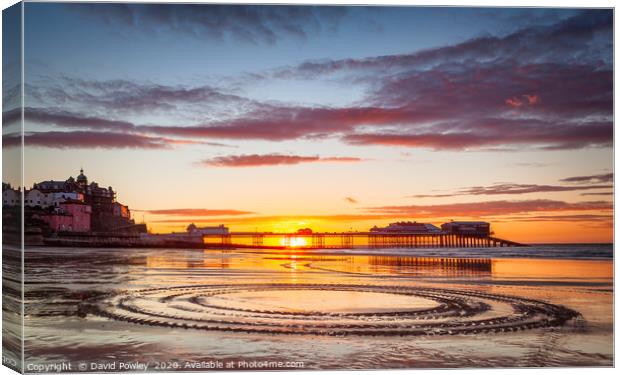Low tide sunset on Cromer beach Canvas Print by David Powley