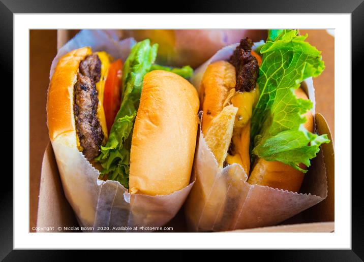 Fresh tasty cheeseburger Framed Mounted Print by Nicolas Boivin