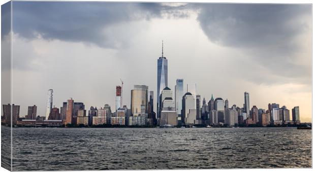 Lower Manhattan Skyline on a cloudy day, NYC, USA Canvas Print by Pere Sanz