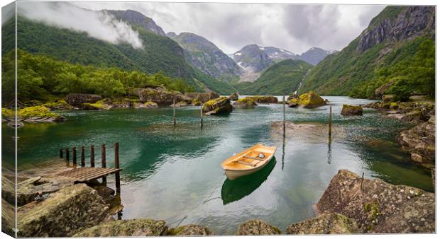 Boat in a lake close to  Buerbreen Glacier, Norway Canvas Print by Pere Sanz