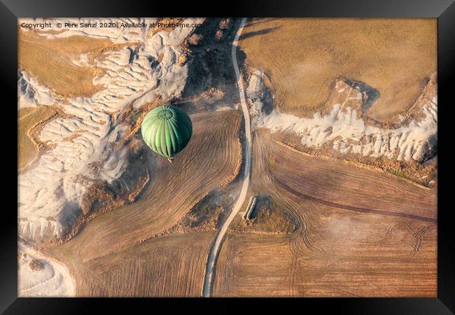 Air balloon landing over grow fields Framed Print by Pere Sanz