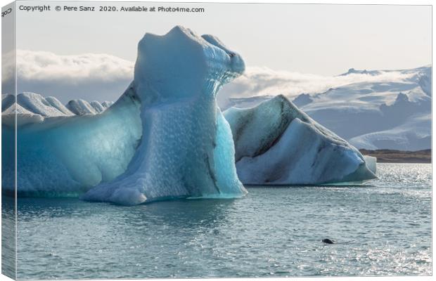 Floating icebergs in Jokulsarlon glacier lagoon Canvas Print by Pere Sanz