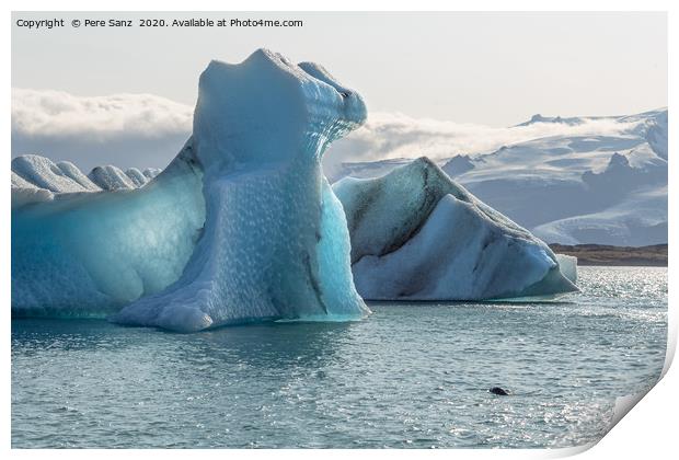 Floating icebergs in Jokulsarlon glacier lagoon Print by Pere Sanz