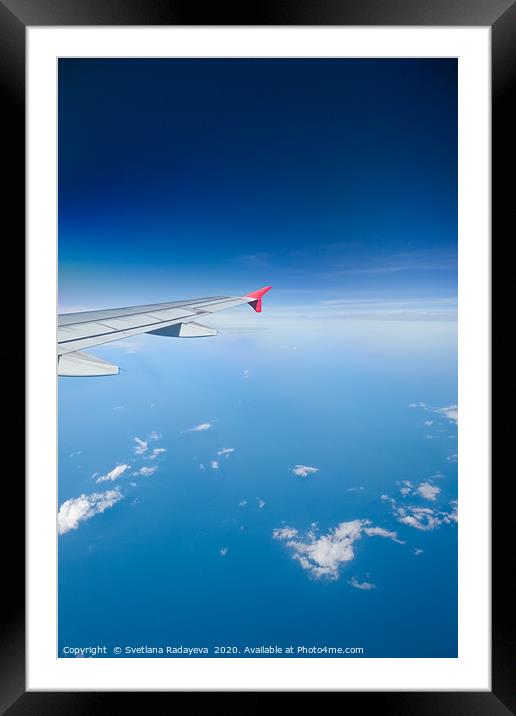 Airliner flying above clouds Framed Mounted Print by Svetlana Radayeva