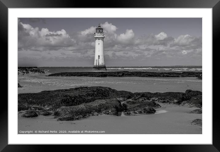 lighthouse in the clouds Framed Mounted Print by Richard Perks