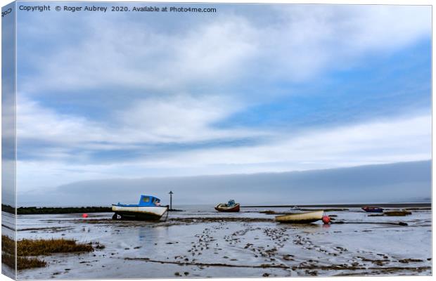 Moored boats, Morecambe Bay Canvas Print by Roger Aubrey