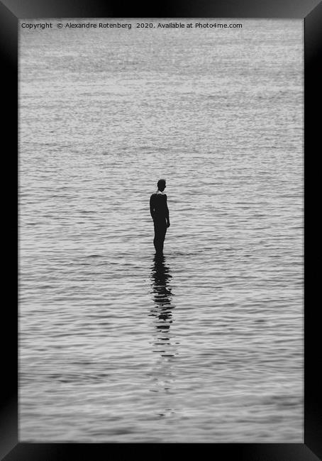 Man standing on water with reflection Framed Print by Alexandre Rotenberg