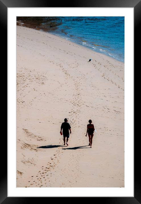 Man and woman walking on sandy beach  Framed Mounted Print by Alexandre Rotenberg