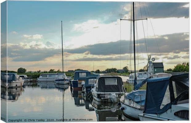 Boats moored up in Thurne Dyke Canvas Print by Chris Yaxley