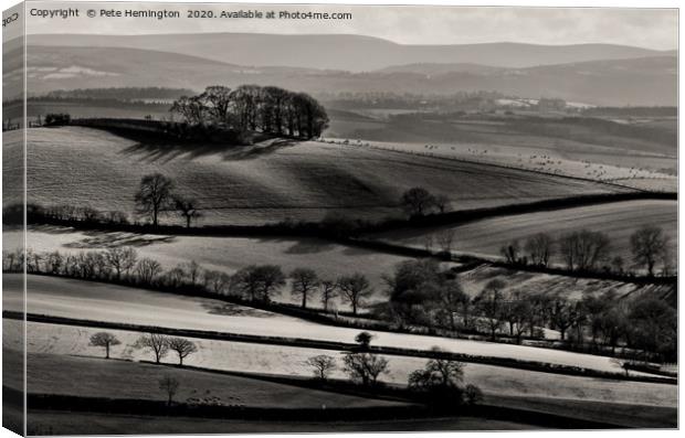 Light on rolling hills in Mid Devon Canvas Print by Pete Hemington