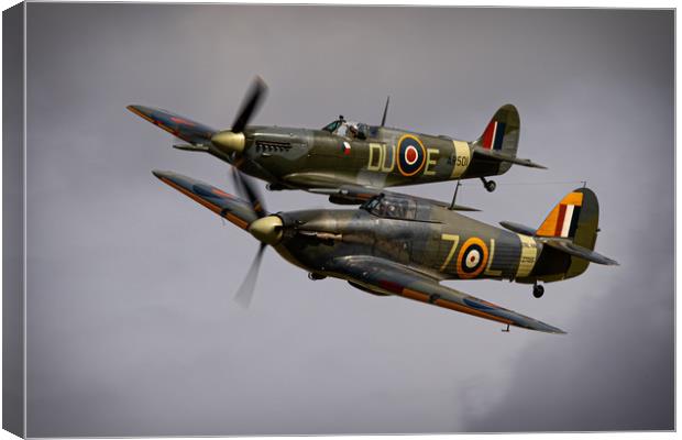 Spitfire and Hurricane Canvas Print by J Biggadike