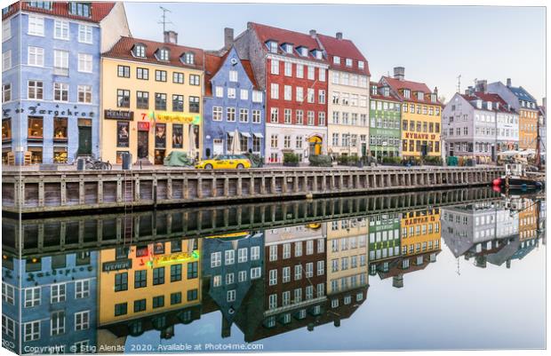 Reataurants on the quay of Nyhavn Canal reflecting Canvas Print by Stig Alenäs