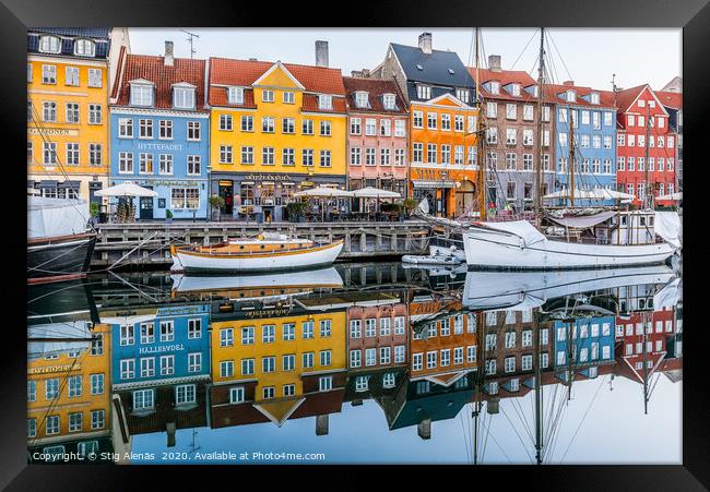 Reflections of colourful houses in the water of Ny Framed Print by Stig Alenäs