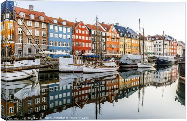 Sailingboats and colourful houses reflecting in th Canvas Print by Stig Alenäs