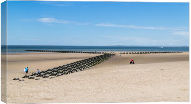 RNLI quad bike monitoring the incoming tide Canvas Print by Jason Wells