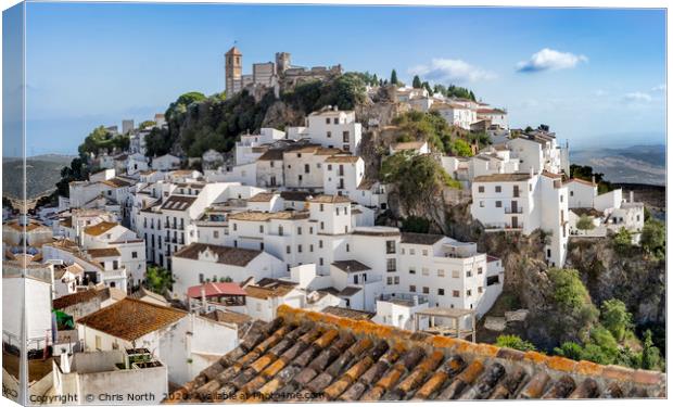 Casares  by day. Canvas Print by Chris North