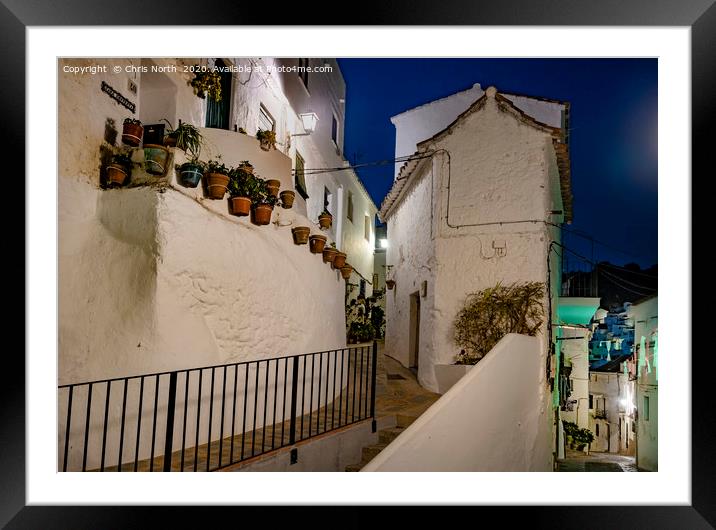 Casares streets by night. Framed Mounted Print by Chris North