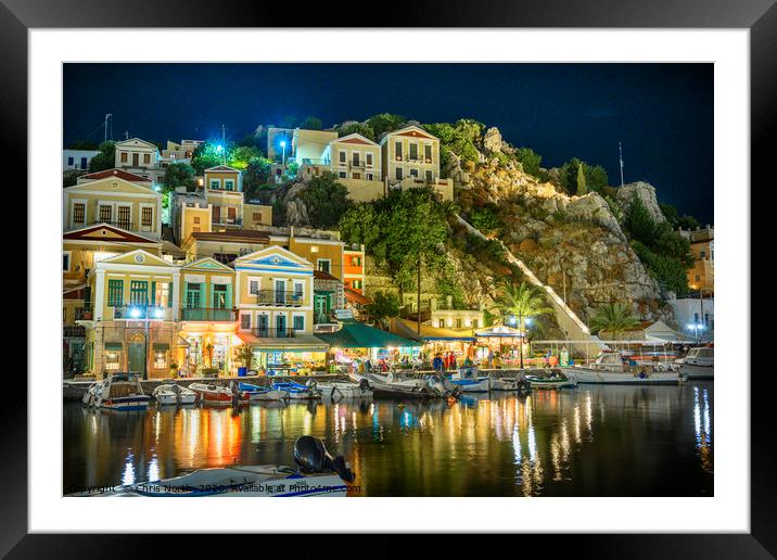 Symi Harbour at night. Framed Mounted Print by Chris North