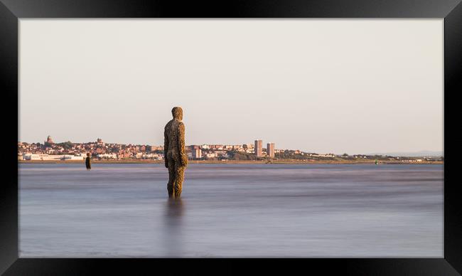 Iron Men watching the incoming tide Framed Print by Jason Wells