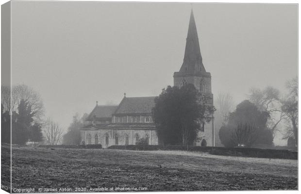 Misty Monring surrounding St Peters Church Denetho Canvas Print by James Aston