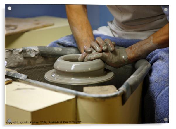 A potter throwing a pot on a potters wheel Acrylic by John Keates