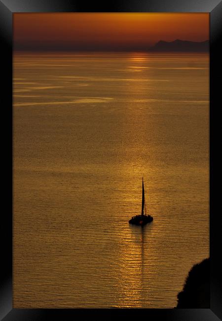 Boat in the Sunset at Oia Framed Print by Jeremy Hayden