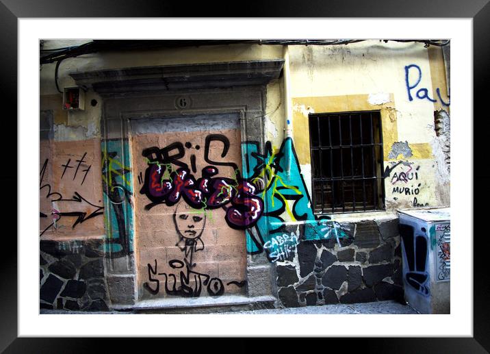 These are graffiti painted on the walls of the his Framed Mounted Print by Jose Manuel Espigares Garc