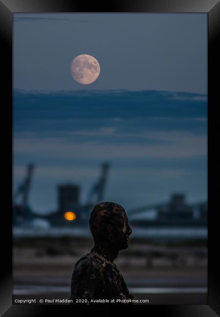 Iron Man and the moon Framed Print by Paul Madden