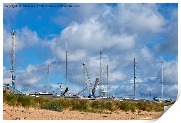 Yachts and Cranes behind the dunes Print by Jim Jones