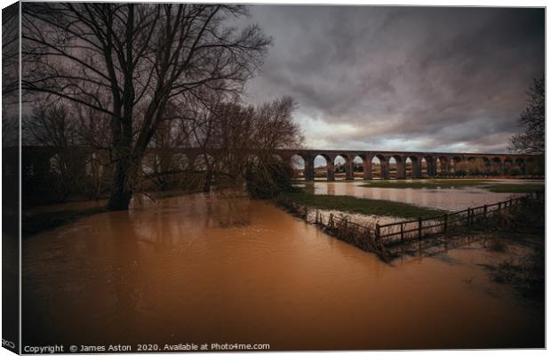 A fully flooded Harringworth Viaduct  Canvas Print by James Aston