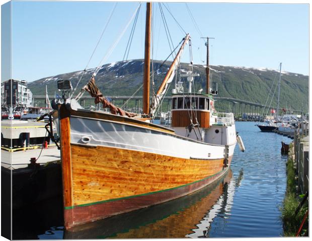 Wooden fishing boat in Tromso Canvas Print by chris hyde