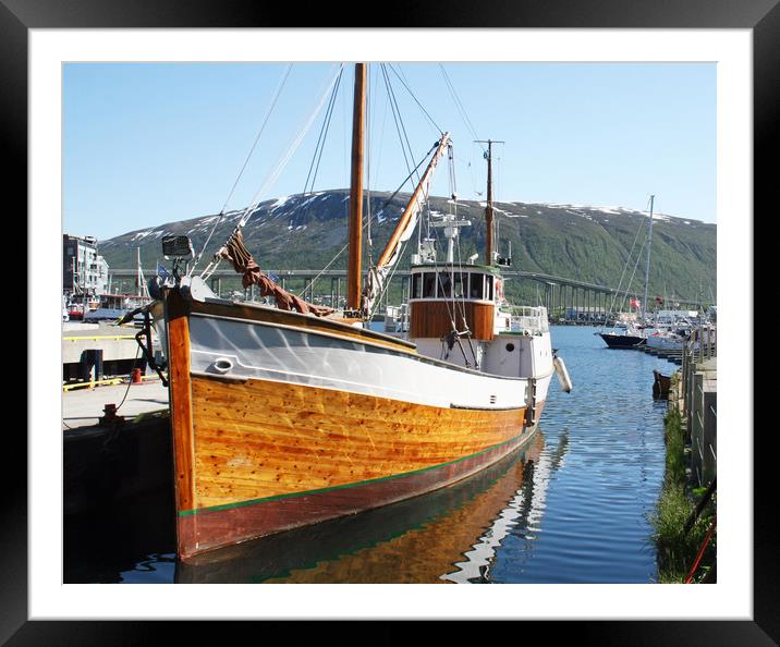Wooden fishing boat in Tromso Framed Mounted Print by chris hyde