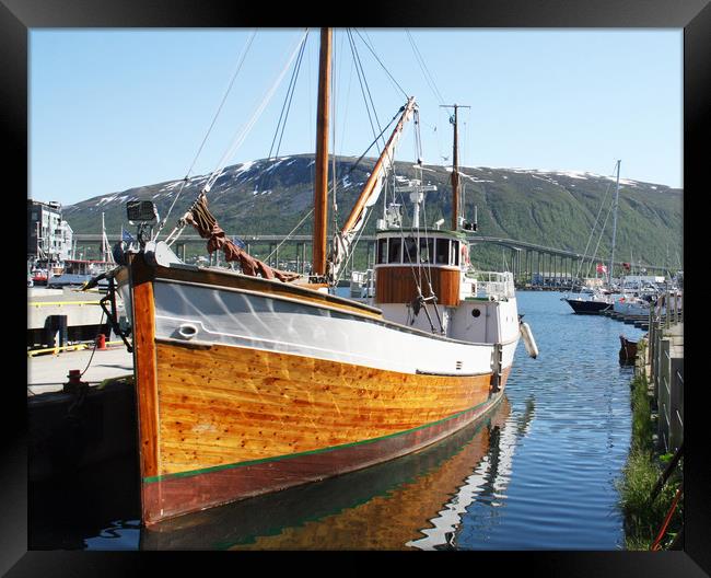 Wooden fishing boat in Tromso Framed Print by chris hyde