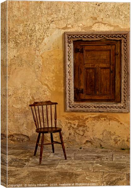 Chair and little door in Abbey Dore Canvas Print by Jenny Hibbert