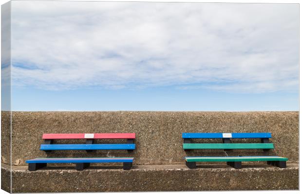 Pair of colourful benches on Wallasey promenade Canvas Print by Jason Wells