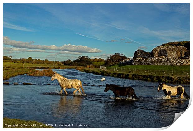 Horses evening crossing at Ogmore ruins Print by Jenny Hibbert