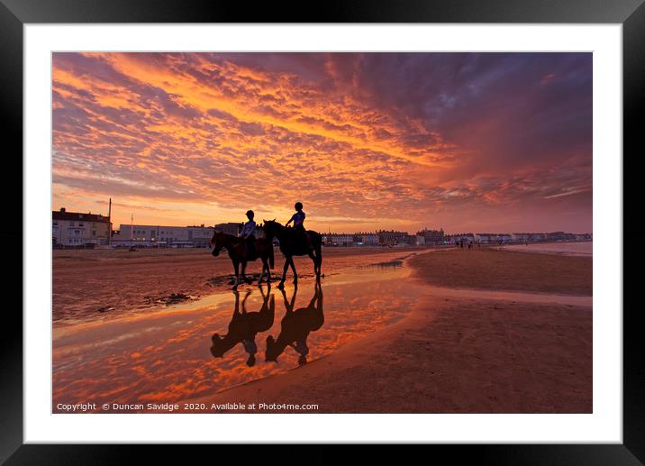 Fiery  sunset on weymouth beach horses Framed Mounted Print by Duncan Savidge