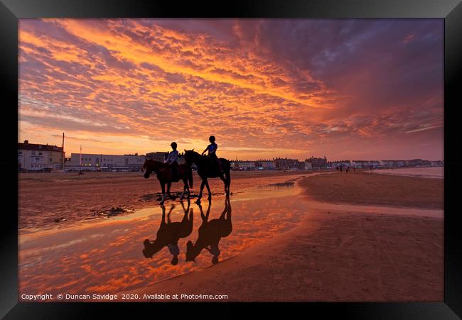 Fiery  sunset on weymouth beach horses Framed Print by Duncan Savidge