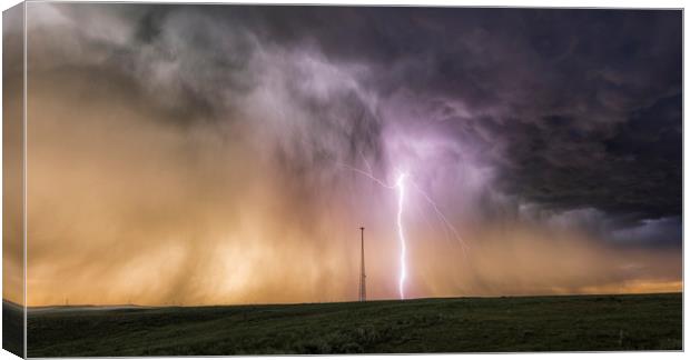 Massive Lightning Bolt next to a cell tower, USA. Canvas Print by John Finney