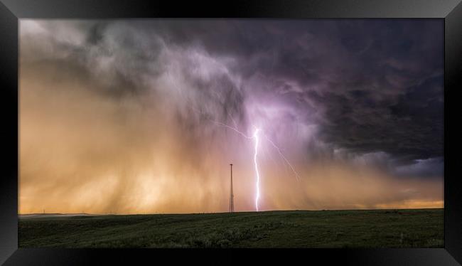 Massive Lightning Bolt next to a cell tower, USA. Framed Print by John Finney