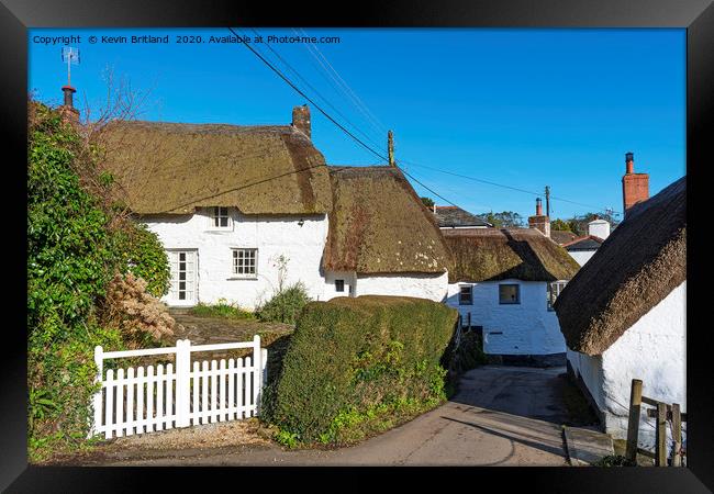 Thatched roof cottages Framed Print by Kevin Britland