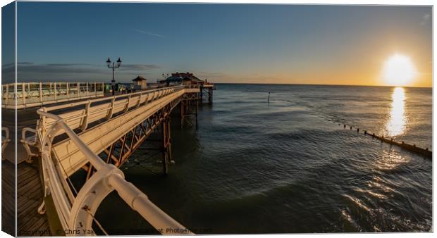 Fisheye view along Cromer Pier at sunrise Canvas Print by Chris Yaxley
